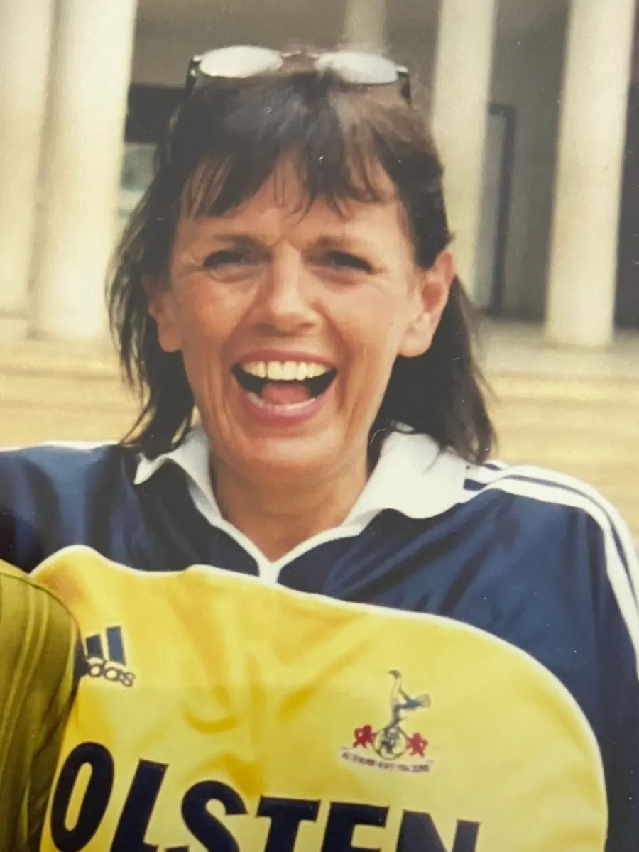 Linda laughing in a football shirt