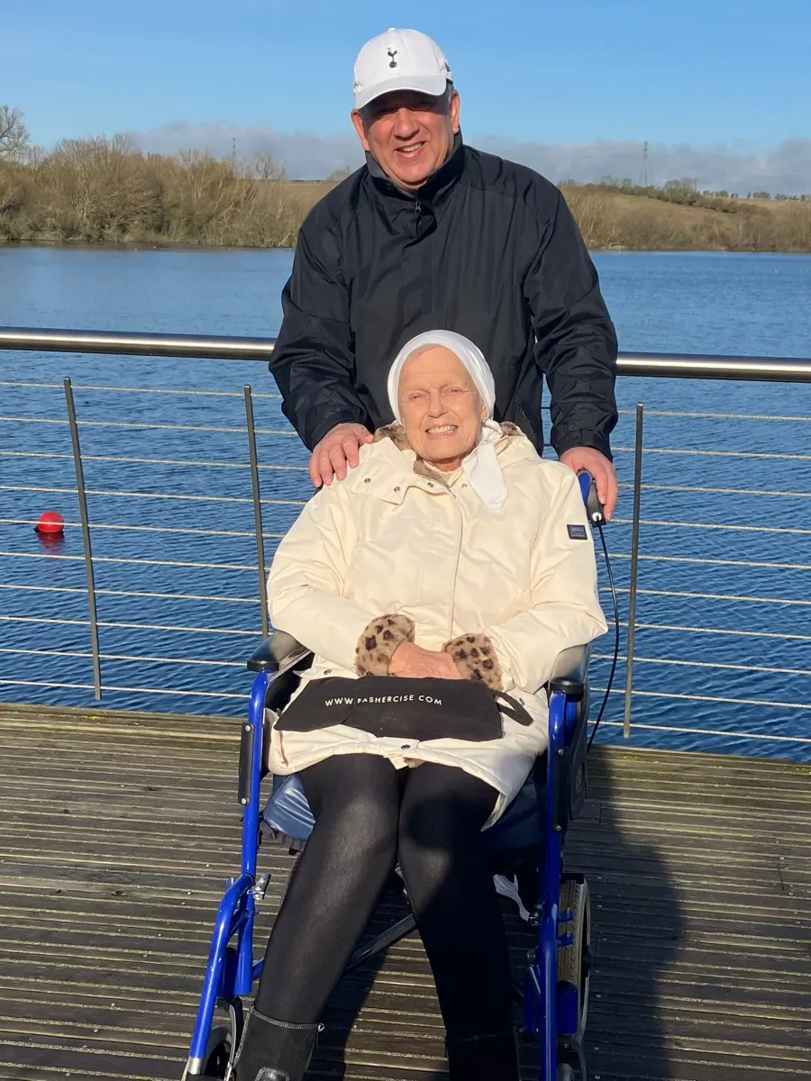 Linda wrapped up warm beside a lake