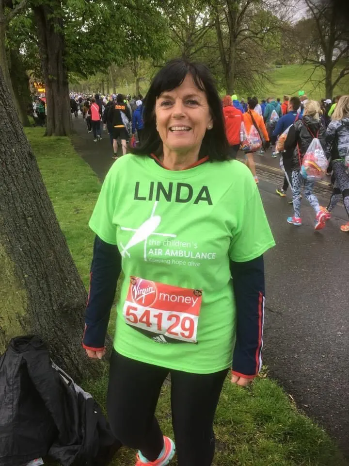 Linda running in a charity race t-shirt, before her diagnosis